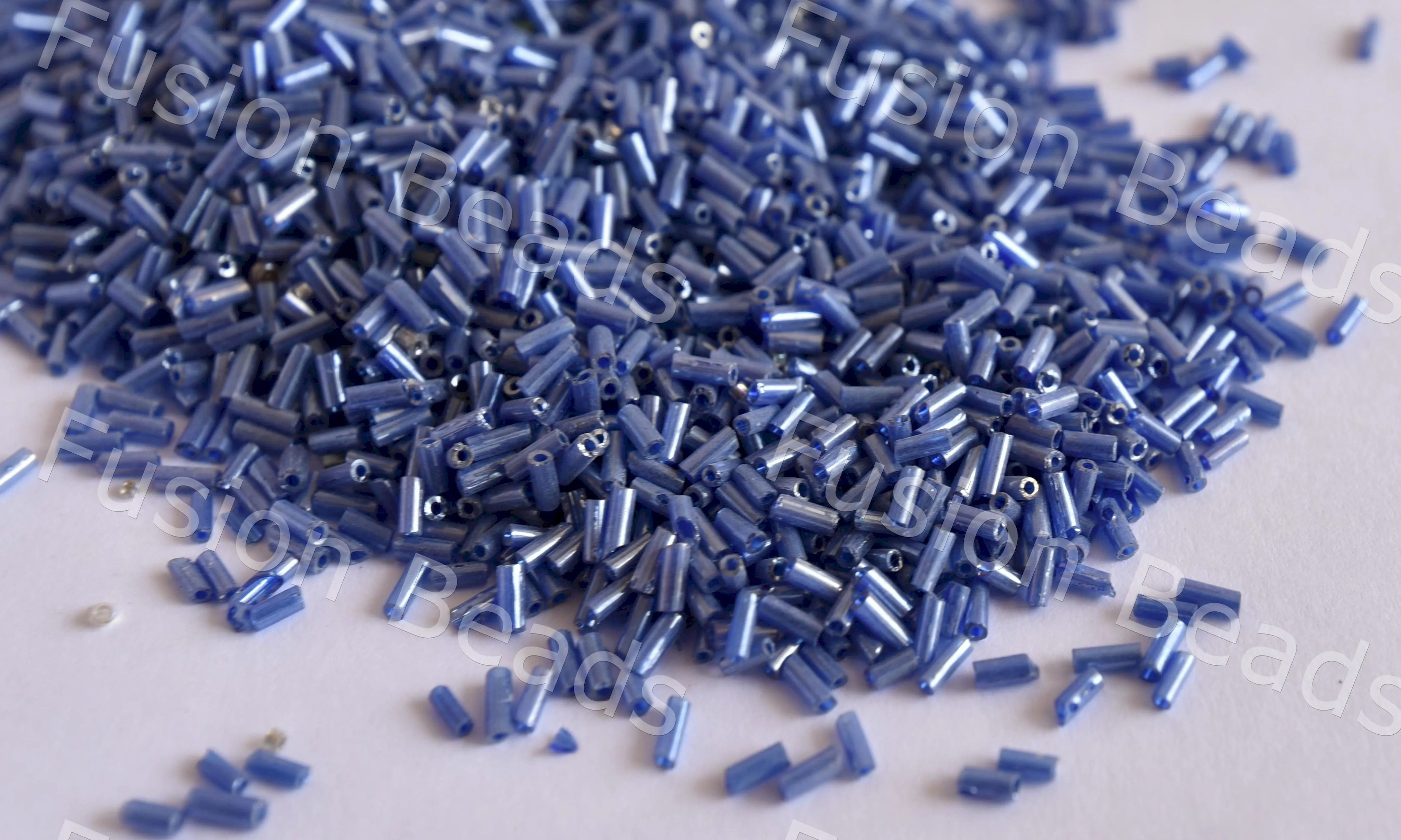 Dark Blue Transparent Luster Bugle / Pipe Beads (Wholesale)